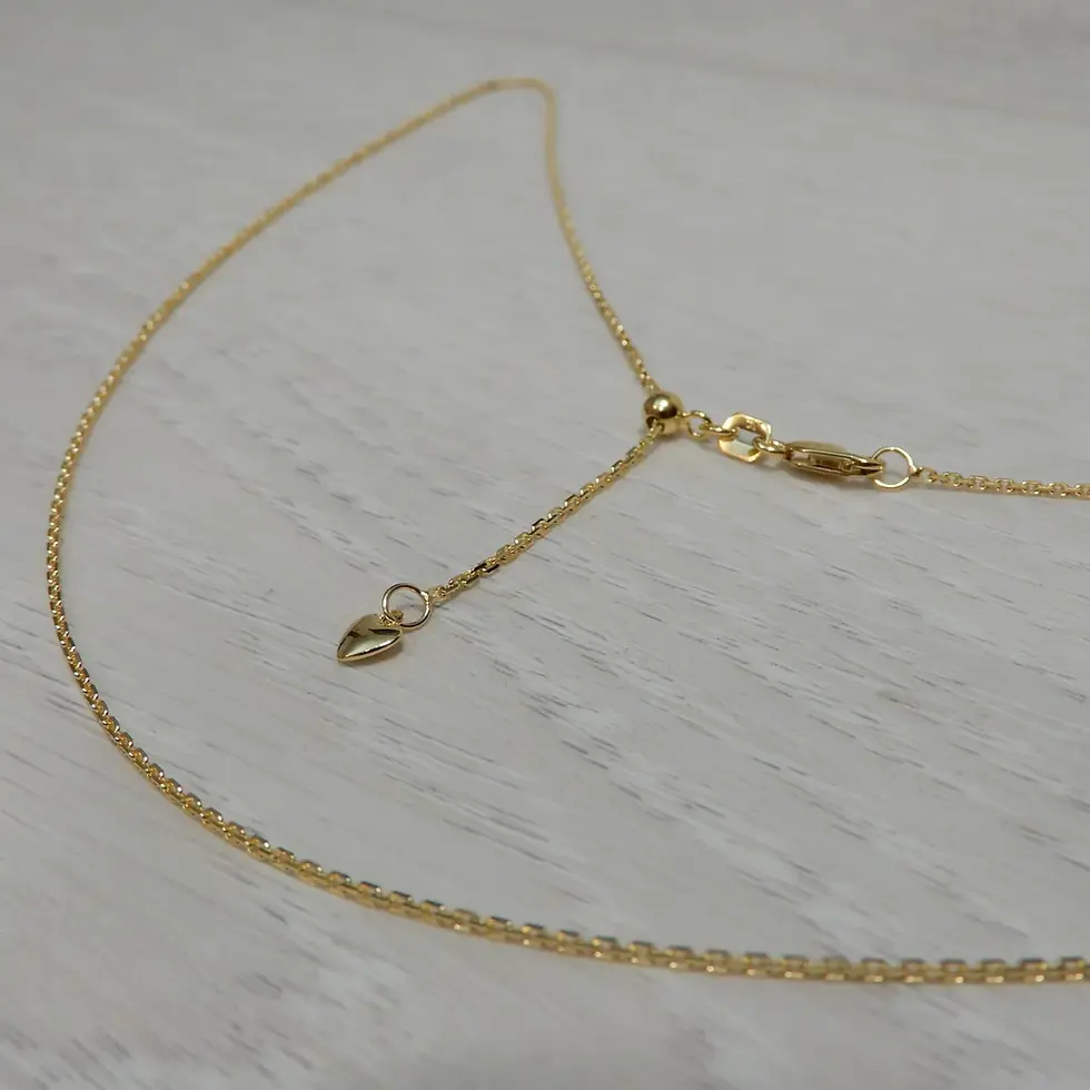 Thumbnail: Fine 1.1mm Italian gold cable chain with extender and clasp laid flat