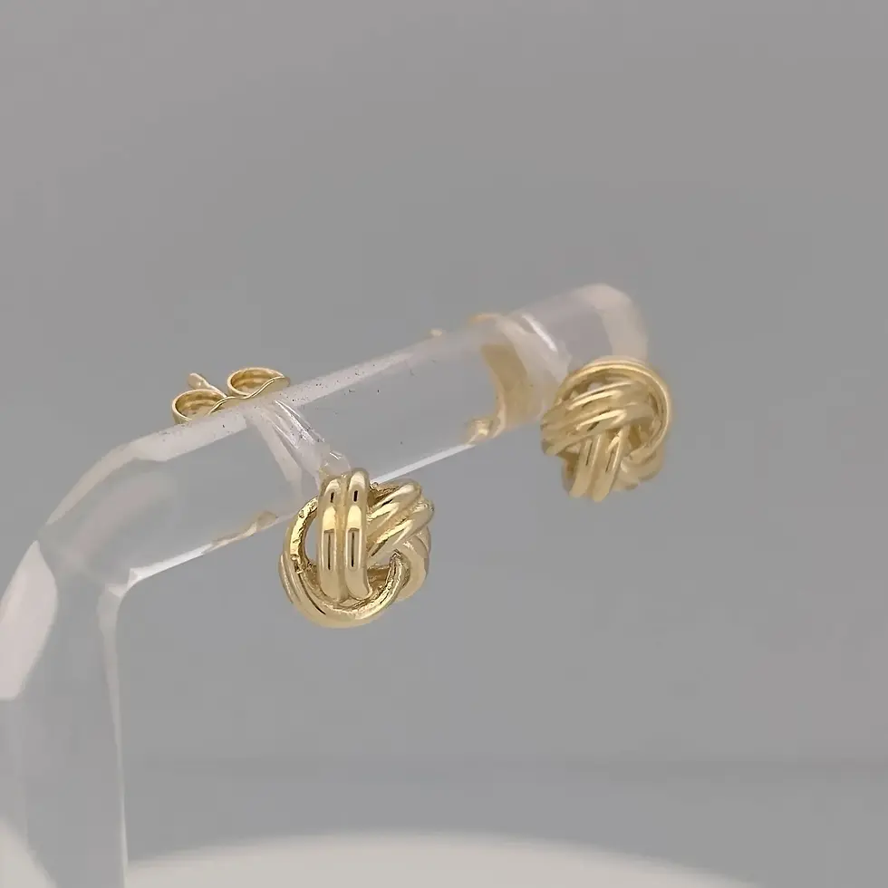 Thumbnail: Angled close-up of 9ct gold love knot earrings with polished interwoven design.