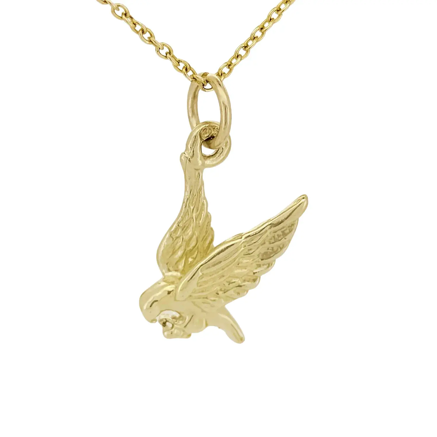 Close-up of 9ct yellow gold eagle charm with outstretched wings