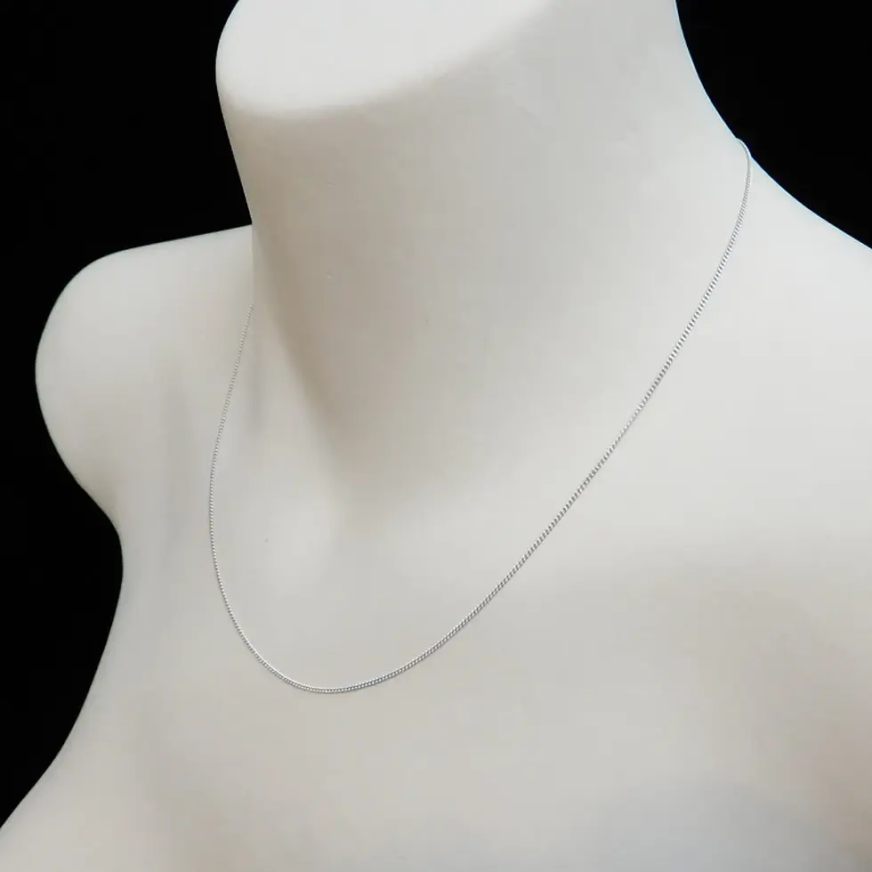 Thumbnail: Polished white gold curb chain necklace displayed on mannequin