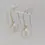 Thumbnail: Front view of 9ct gold hook earrings with pearl drops on clear stand.