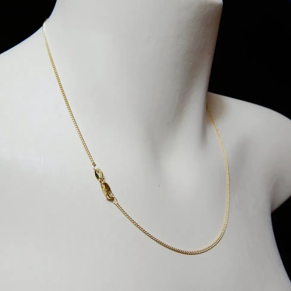 Thumbnail: Polished 9ct yellow gold curb chain styled for everyday wear on bust