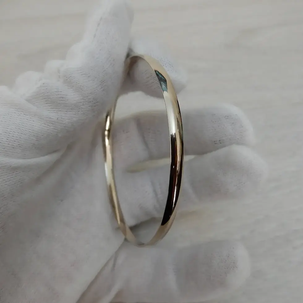 Thumbnail: Classic 4mm gold bangle shown in hand with white glove