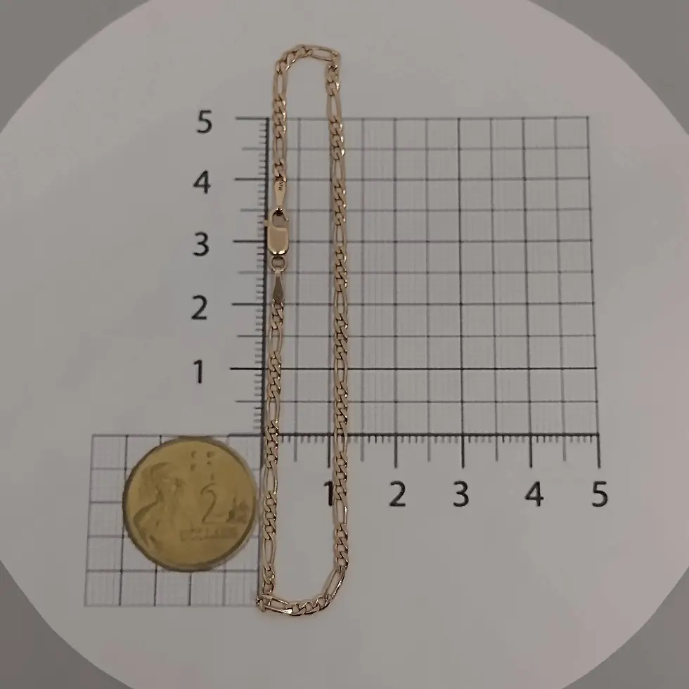 Thumbnail: 9ct rose gold Figaro chain anklet with 2.1mm links shown next to ruler and coin for scale