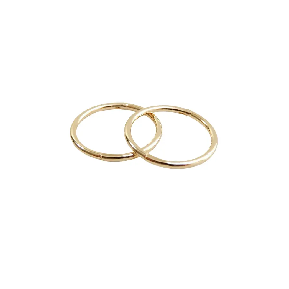 Thumbnail: Two 12mm yellow gold sleeper earrings isolated on white background
