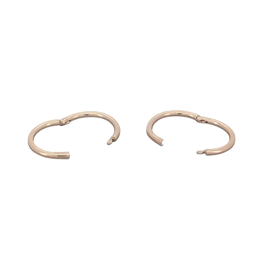 Two rose gold hinged sleeper hoops slightly open clasp view