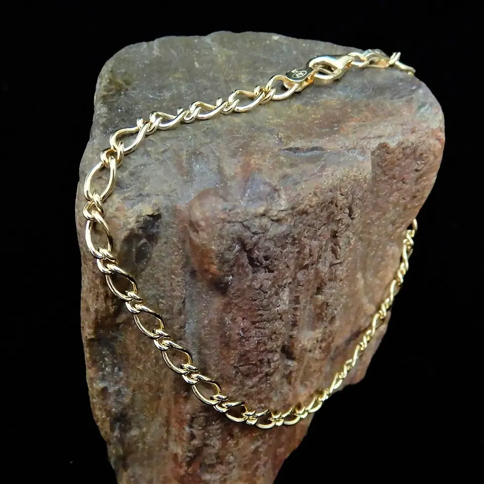 Thumbnail: Classic 3.4mm Figaro bracelet in yellow gold styled on stone background