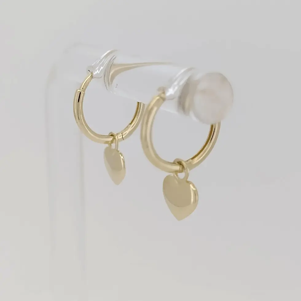 Thumbnail: Side view of 9ct gold huggie earrings with dangling polished heart charms.