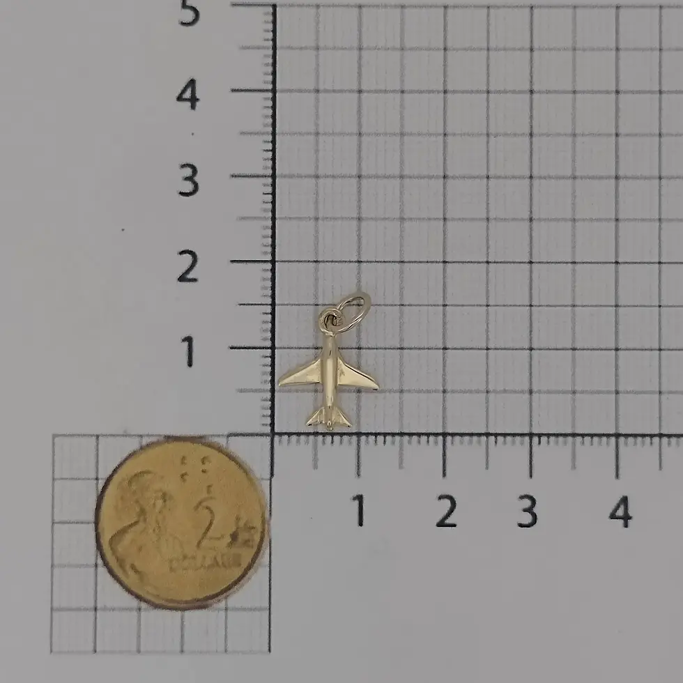 Thumbnail: Airplane charm photographed beside ruler and coin for size reference