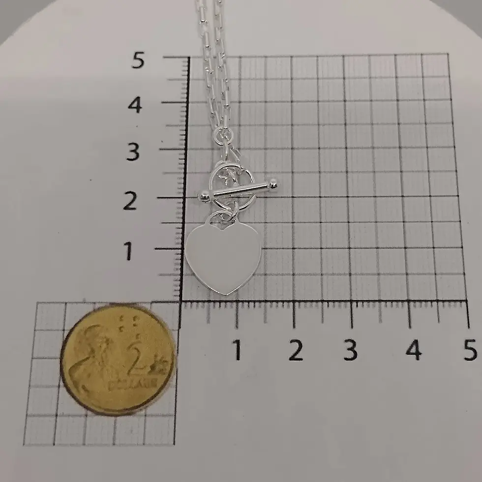 Thumbnail: Sterling silver heart charm necklace shown beside ruler and coin for size reference