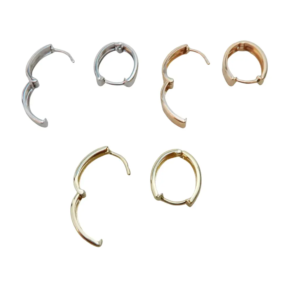 Thumbnail: Assorted 9ct gold huggie earrings displayed in group layout