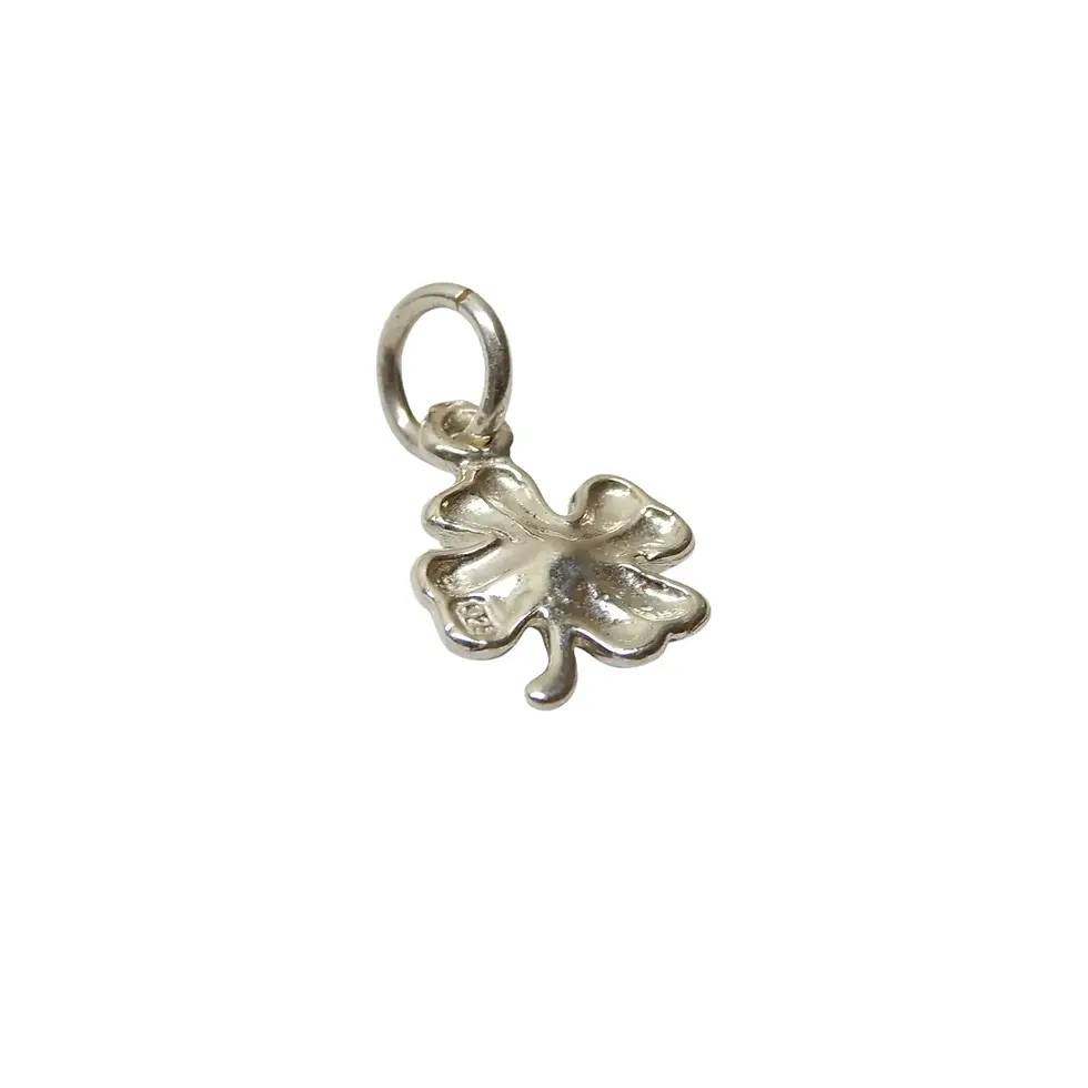 Thumbnail: Small silver four leaf clover charm isolated on plain background