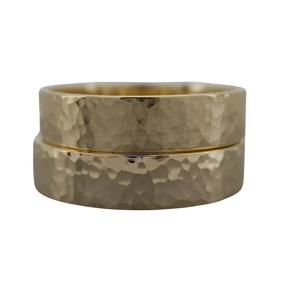 Pair of 9ct yellow gold hammered band rings stacked together.