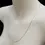 Thumbnail: White gold 1.4mm curb chain necklace displayed at angle on mannequin