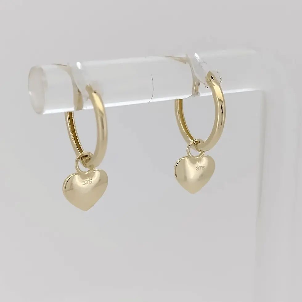 Front view of 9ct gold 10mm huggie hoop earrings with small heart drops.