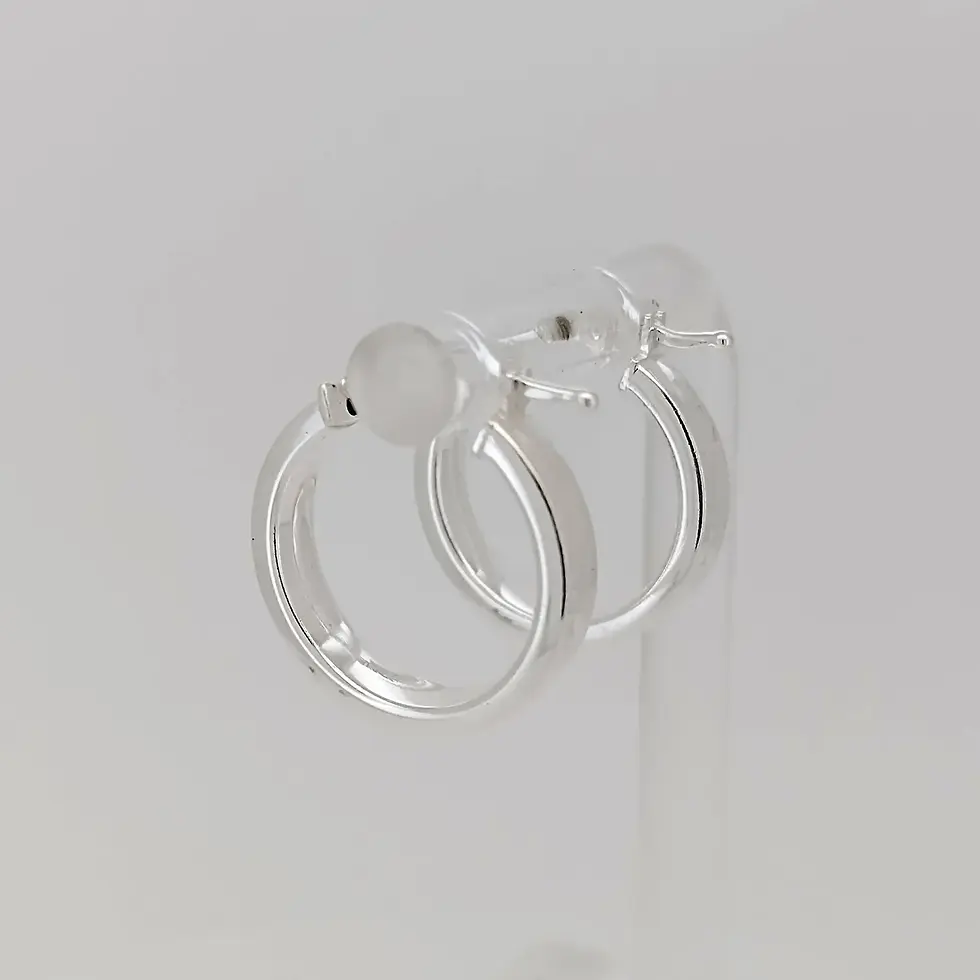 Thumbnail: Reverse angled display of sterling silver faceted hoop earrings on stand.