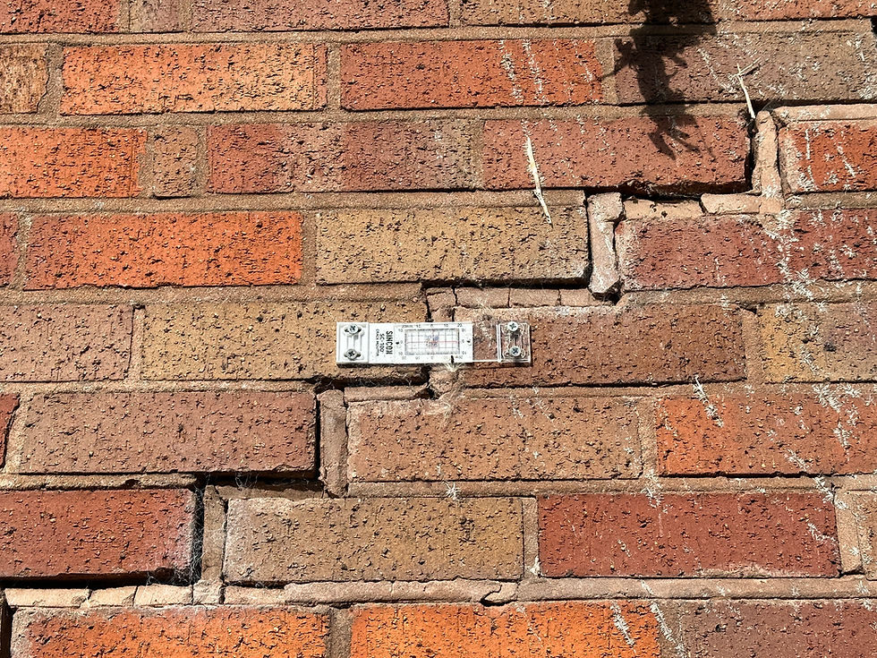 Structural cracking to a brick wall in Wombourne. The crack has been fitted with a crack monitor.