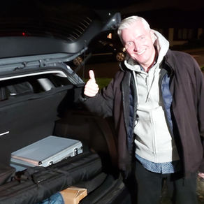 Peter Stanford loading his car with sound equipment for another event in Brighton