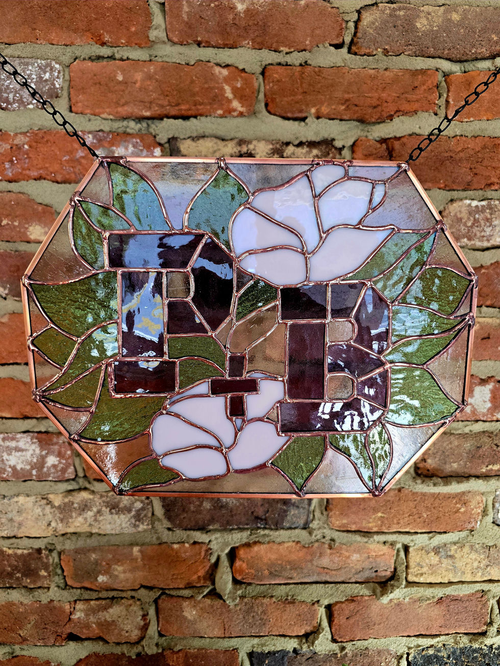 Stained glass initials "DB" with roses