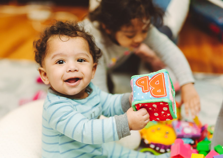 happy-mixed-race-toddler-boy-at-home-playing-with-2023-11-27-04-59-29-utc.jpg