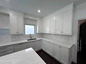 Custom Kitchen Cabinets with tile backsplash and hardwood floors