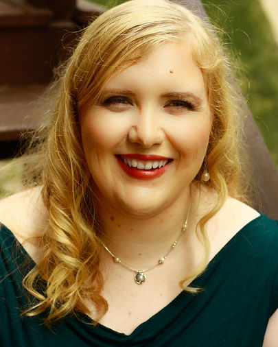 Headshotsmiling (1).jpg