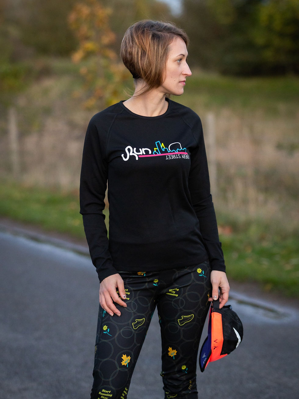 Thumbnail: black long sleeve top front view with run every street design