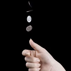 hand flipping a coin