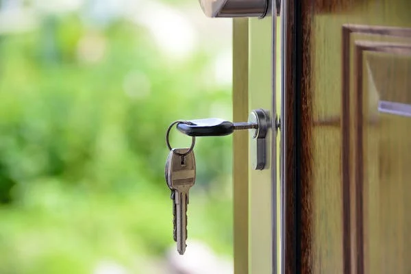 key in the door of a house