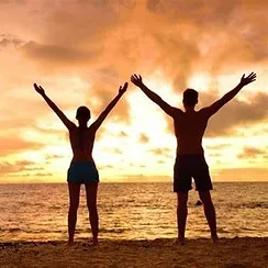 two people with their hands in the air