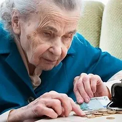 older woman counting money