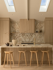 Natural stone island bench in the Malia Beach House kitchen