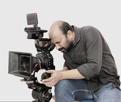 Prem with Camera_edited.png