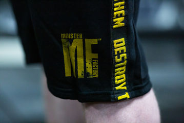 Two male bodybuilder models wearing Monster Factory Clothing, captured in a high-quality photoshoot by Jamie Bulman. The photo is used for promoting the brand and has increased their engagement by 700%