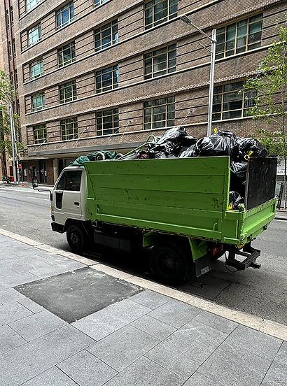 Rubbish collection truck parked in Alexandria's urban streets and filled with bags of mixed rubbish after a job in the area.