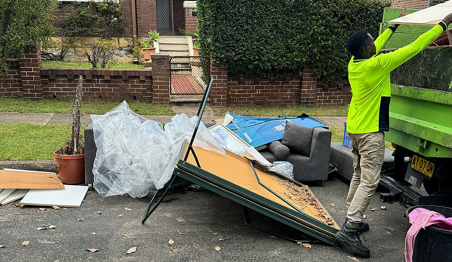 Collection of old furniture and residential waste including a bulky sofa from a property in NSW.