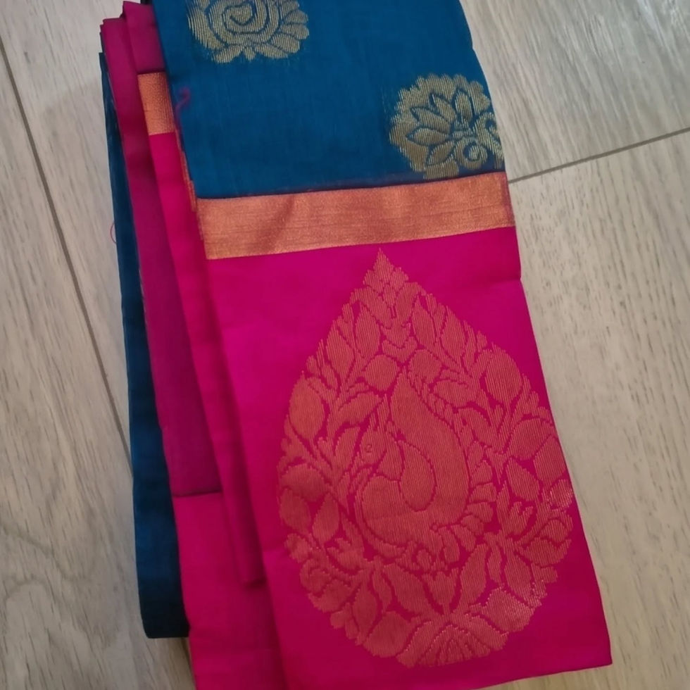Folded blue and pink cotton saree with golden motifs