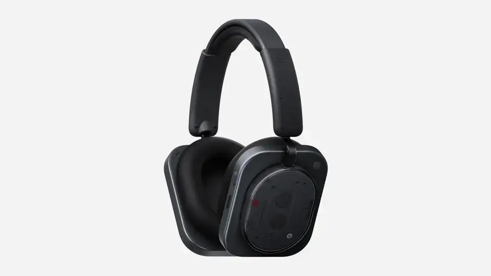 Black over-ear headphones with a transparent design, showing internal components. Set against a plain gray background. Modern and sleek.