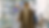 Man in airport with suitcase, wearing glasses and brown coat, looks at digital August 2025 calendar. Text: Intuitive Scheduling. Emphasizes tech.