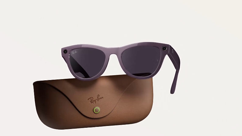 Purple sunglasses hover above a brown Ray-Ban case on a white background. Sunglasses feature a digital camera on the upper corner.