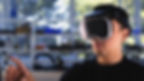 A person wearing a VR headset interacts in a lab setting with shelves. Natural light filters through a window, creating a focused mood.