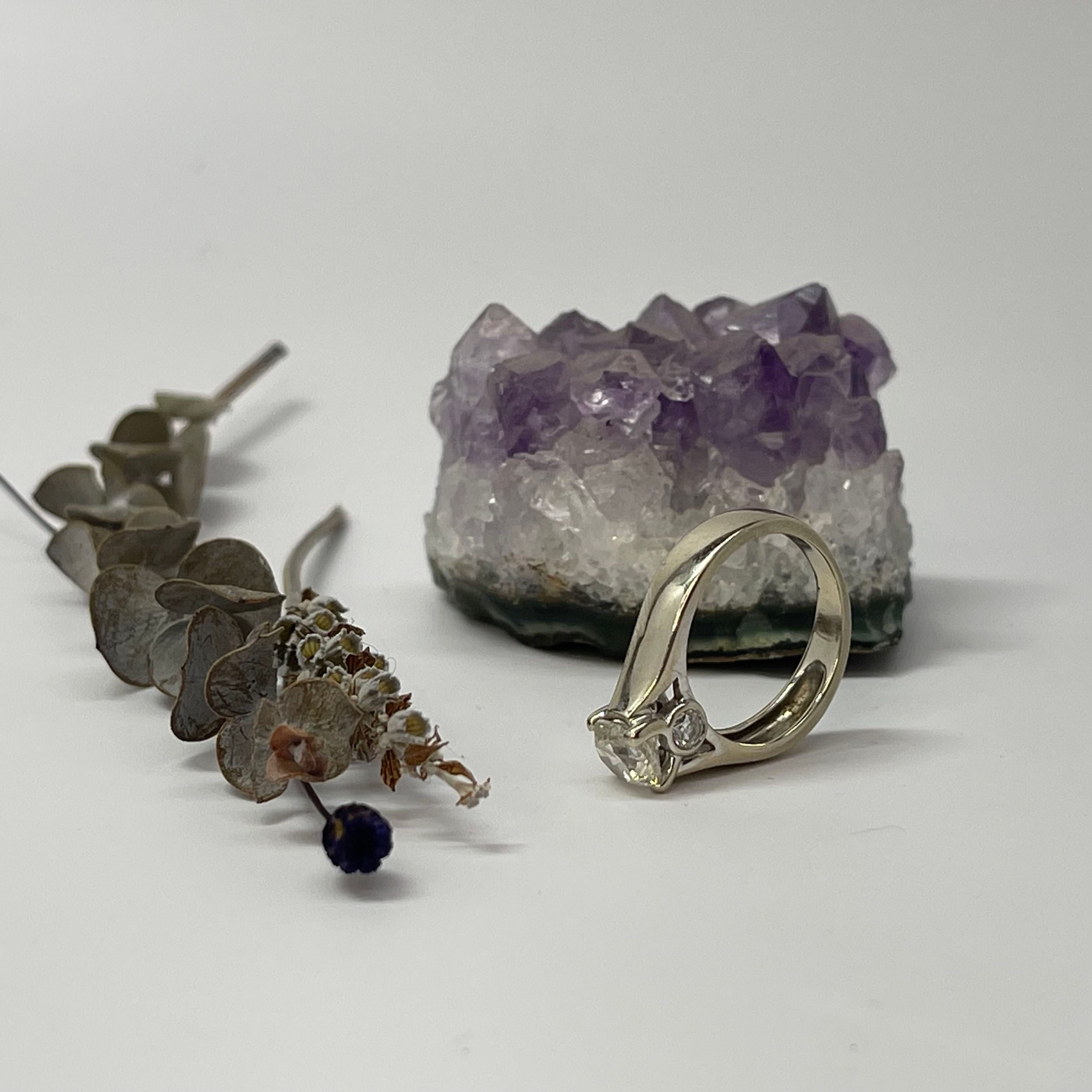 Round Brilliant Diamond Solitaire with side diamonds