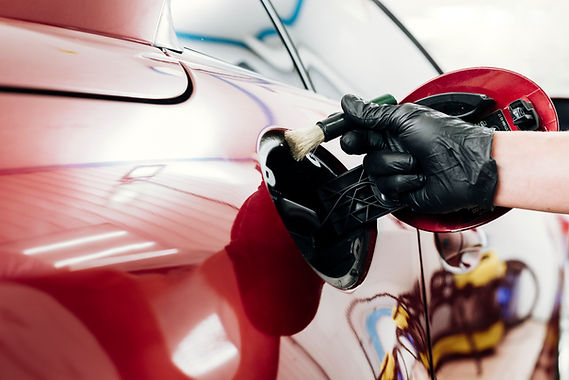 close-up-person-cleaning-car-exterior.jpg