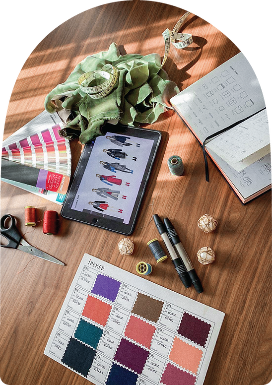 A fashion design process with ipad digital illustration, fabrics, and pantone cards