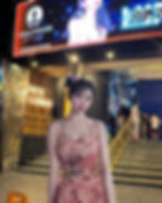 DJ Hanini captivating the audience at a high-profile party in Pattaya, showcasing her sensual curves and alluring presence.