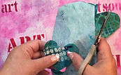 Cutting out handmade collage papers