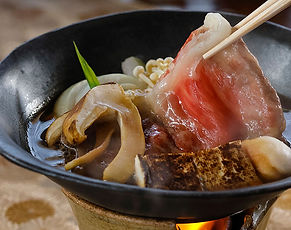 Elegant Japanese restaurant offering seasonal dishes and private dining options in a serene setting.