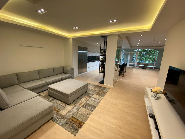 An open floor plan connecting the family room with the kitchen and living room