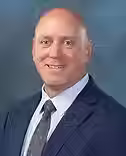 Tom Koutroulis Head Shot_edited.avif