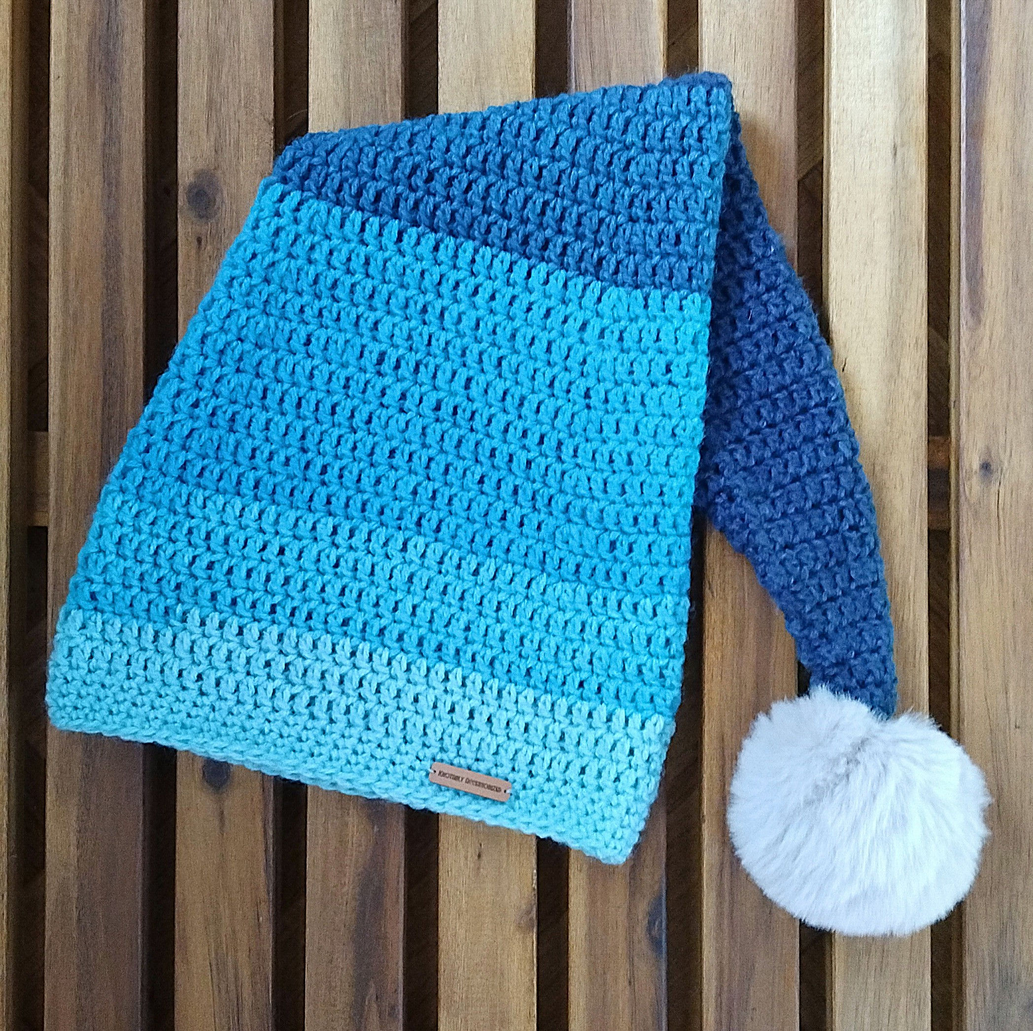 Hand-crocheted nightcap beanie with faux fur pompom
